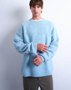 Model wearing Relaxed fit boucle jumper in mid blue