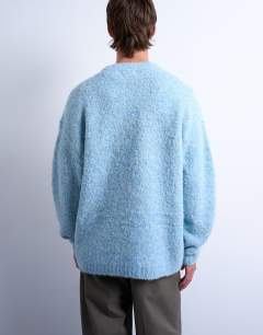 Model wearing Relaxed fit boucle jumper in mid blue