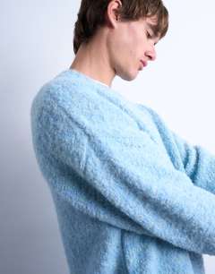 Model wearing Relaxed fit boucle jumper in mid blue