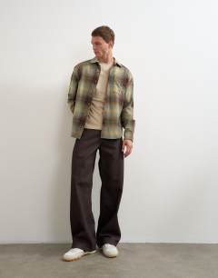 Model wearing Relaxed fit brushed cotton check overshirt in brown and yellow