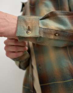 Model wearing Relaxed fit brushed cotton check overshirt in brown and yellow