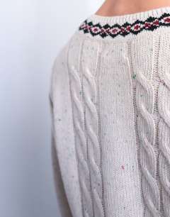 Model wearing Relaxed fit cable knitted v-neck jumper with fairisle trim in ecru