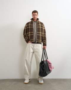 Model wearing Relaxed fit check knitted zip through jumper in brown