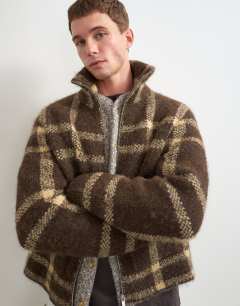 Model wearing Relaxed fit check knitted zip through jumper in brown