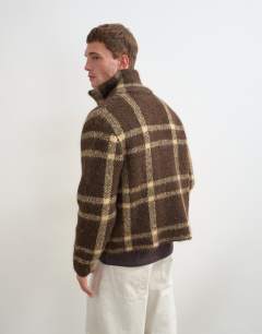 Model wearing Relaxed fit check knitted zip through jumper in brown