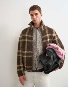 Model wearing Relaxed fit check knitted zip through jumper in brown
