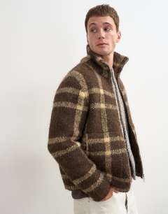 Model wearing Relaxed fit check knitted zip through jumper in brown