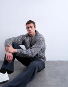 Model wearing Relaxed fit chunky twist cardigan in navy