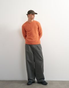 Model wearing Relaxed fit crewneck knitted jumper in orange