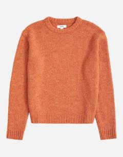 Model wearing Relaxed fit crewneck knitted jumper in orange