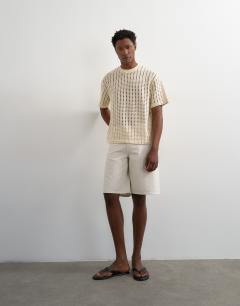 Model wearing Relaxed fit crochet t shirt in ecru