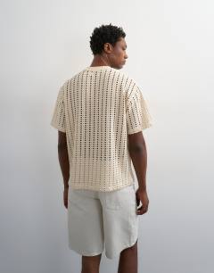 Model wearing Relaxed fit crochet t shirt in ecru