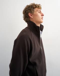 Model wearing Relaxed fit crop 1/4 zip brushed funnel neck sweatshirt in brown