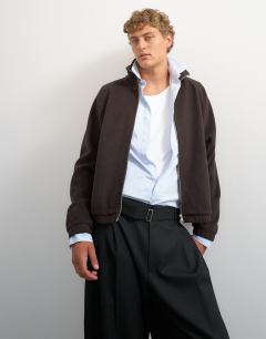Model wearing Relaxed fit crop 1/4 zip brushed funnel neck sweatshirt in brown