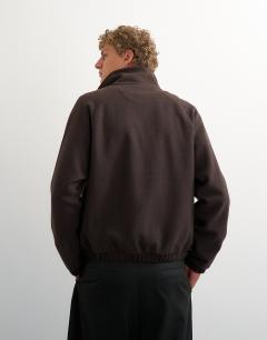 Model wearing Relaxed fit crop 1/4 zip brushed funnel neck sweatshirt in brown