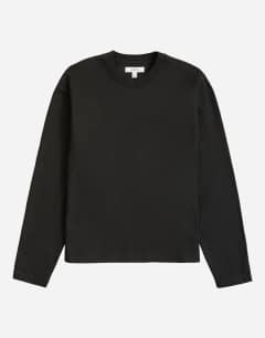 Model wearing Relaxed fit crop long sleeve t-shirt in black