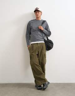 Model wearing Relaxed fit crop long sleeve t-shirt with panel detail in washed grey