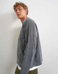 Model wearing Relaxed fit crop long sleeve t-shirt with panel detail in washed grey