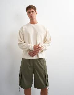 Model wearing Relaxed fit crop pique waffle long sleeve t-shirt in ecru