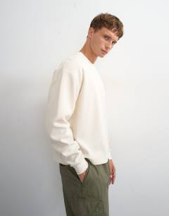 Model wearing Relaxed fit crop pique waffle long sleeve t-shirt in ecru