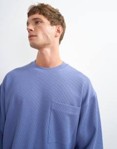 Model wearing Relaxed fit crop pique waffle long sleeve t-shirt in french blue