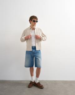 Model wearing Relaxed fit crop seersucker shirt in stone