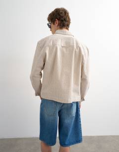 Model wearing Relaxed fit crop seersucker shirt in stone