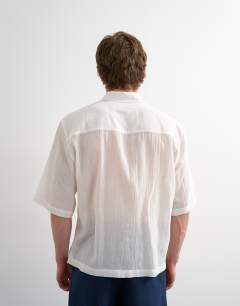 Model wearing Relaxed fit crop sheer ripstop short sleeve shirt in white