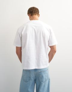 Model wearing Relaxed fit crop t-shirt in white