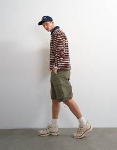 Model wearing Relaxed fit crop velour stripe polo in navy
