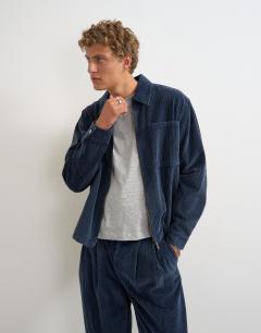 Model wearing Relaxed fit crop washed cord overshirt in washed blue