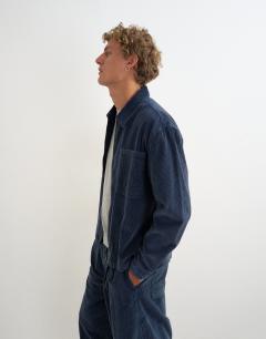 Model wearing Relaxed fit crop washed cord overshirt in washed blue