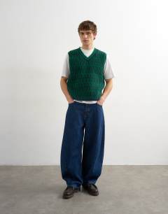 Model wearing Relaxed fit cropped knitted tank in green