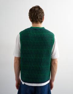 Model wearing Relaxed fit cropped knitted tank in green