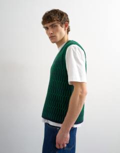 Model wearing Relaxed fit cropped knitted tank in green