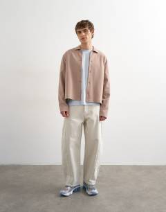 Model wearing Relaxed fit cropped polo in taupe