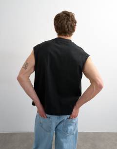 Model wearing Relaxed fit cropped sleeveless t-shirt in black