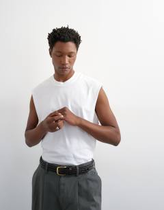 Model wearing Relaxed fit cropped sleeveless t-shirt in white
