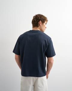 Model wearing Relaxed fit cropped t-shirt in navy