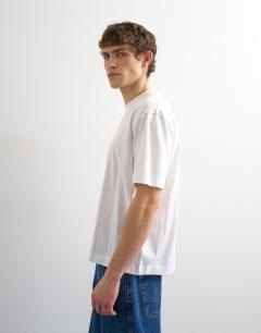 Model wearing Relaxed fit cropped t-shirt in white