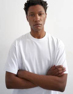 Model wearing Relaxed fit cropped t-shirt in white