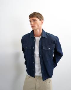 Model wearing Relaxed fit denim overshirt in mid blue