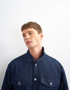 Model wearing Relaxed fit denim overshirt in mid blue