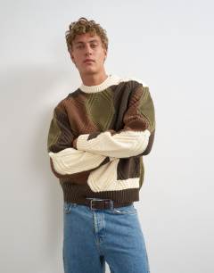 Model wearing Relaxed fit diamond cable knit jumper with camo design in multi