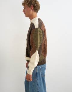 Model wearing Relaxed fit diamond cable knit jumper with camo design in multi