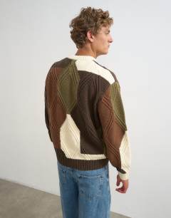 Model wearing Relaxed fit diamond cable knit jumper with camo design in multi