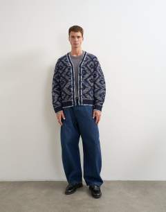 Model wearing Relaxed fit diamond knitted cardigan in navy