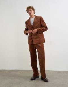 Model wearing Relaxed fit double breasted velvet stripe blazer in tan