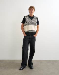 Model wearing Relaxed fit fairisle knitted v neck tank in black
