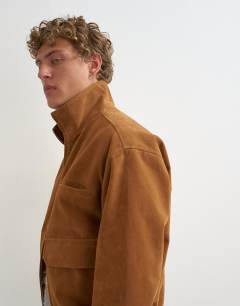 Model wearing Relaxed fit faux suede funnel neck bomber with double zip in tan